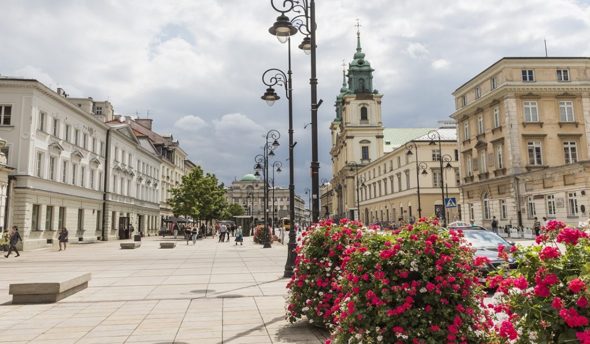 WARSAW - JULY 09: Holy Cross Church built between 1679-1696 in Baroque style and Staszic Palace built between 1820-1823 in the classical style in Warsaw in Poland on July 09, 2015