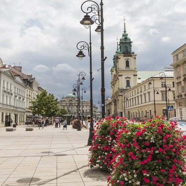 WARSAW - JULY 09: Holy Cross Church built between 1679-1696 in Baroque style and Staszic Palace built between 1820-1823 in the classical style in Warsaw in Poland on July 09, 2015